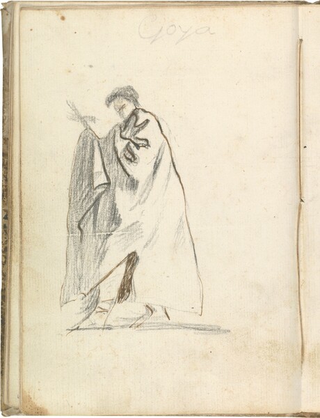Figura masculina de perfil con manto, portando una cruz